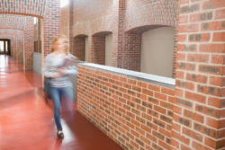 Student walking in a hallway