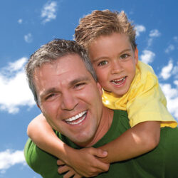 A father and son wearing Packer colors