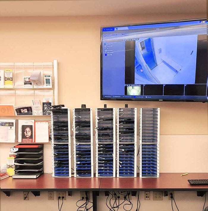 Image shows 10 PowerGistics charging stations for small tablets or phone on a desk