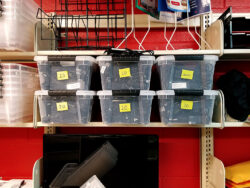 Charging cords in clear bins