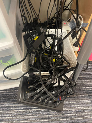 Image shows messy cables of device charging