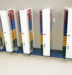 Image shows five PowerGistics charging stations next to each other in a school hallway