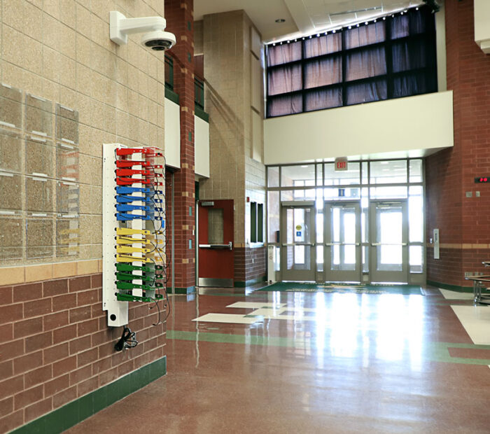 Images shows PowerGistics charging station on wall in school commons